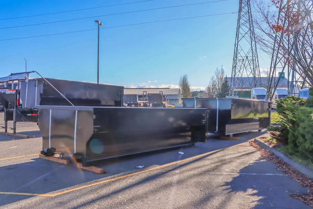 Roll-off dumpster ready for waste disposal at job site for 2 Yard Dumpster Rental in Green Lake